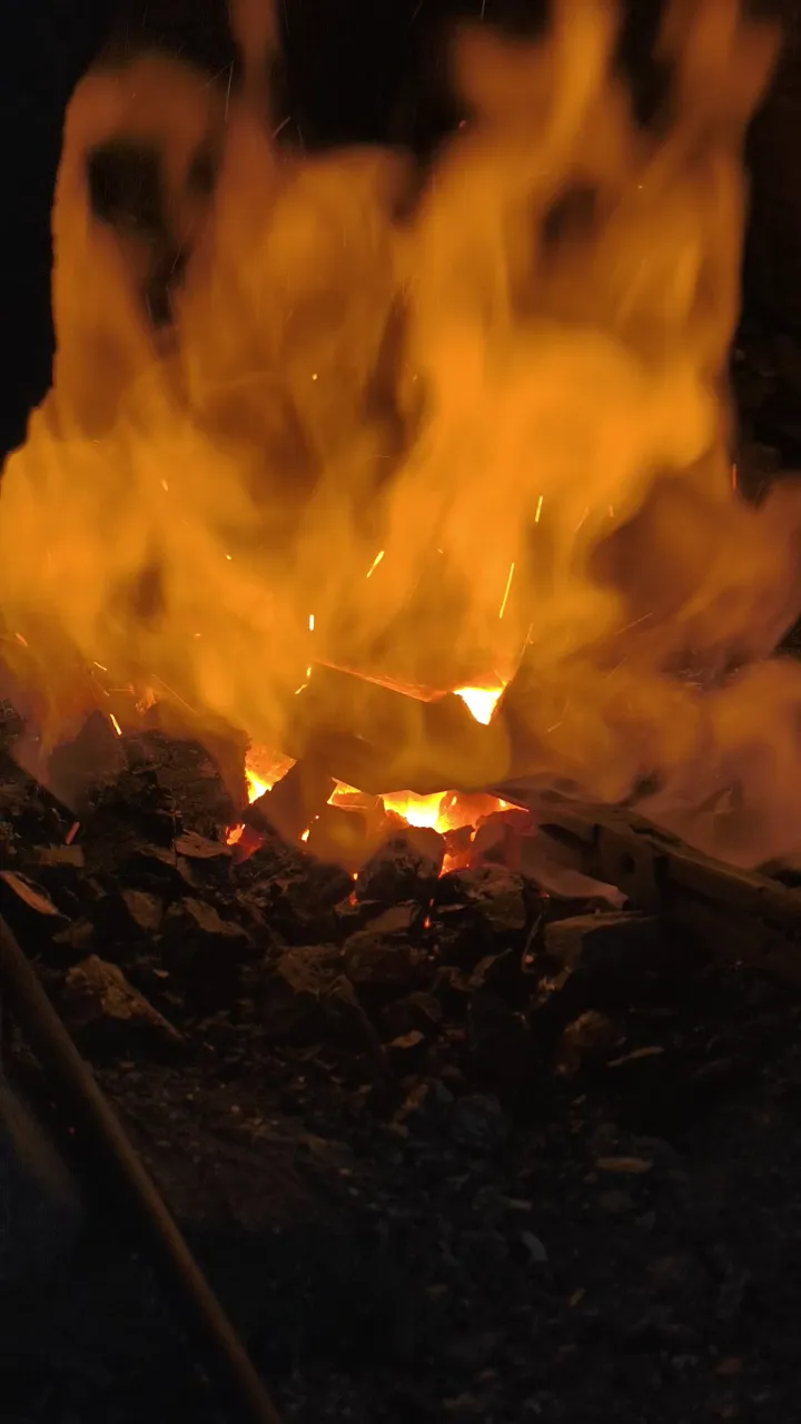 Steel heating in a forge fire